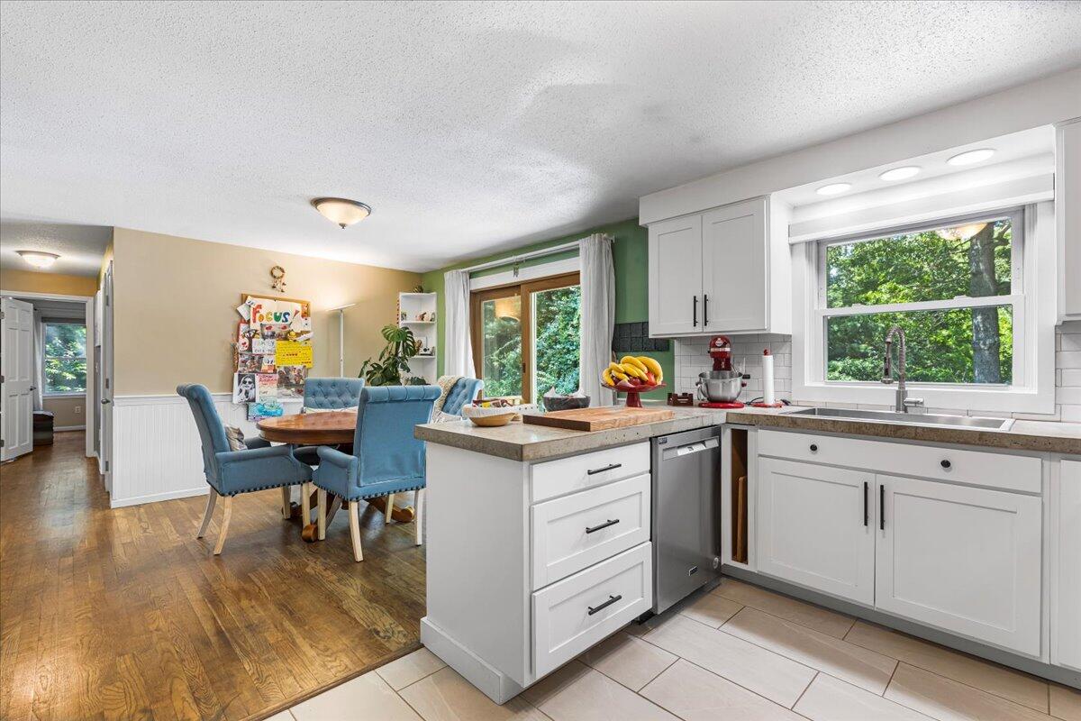 48 Valley Brook Road Centerville, MA 02632 - Photo 17 of 34 a kitchen with sink cabinets and wooden floor