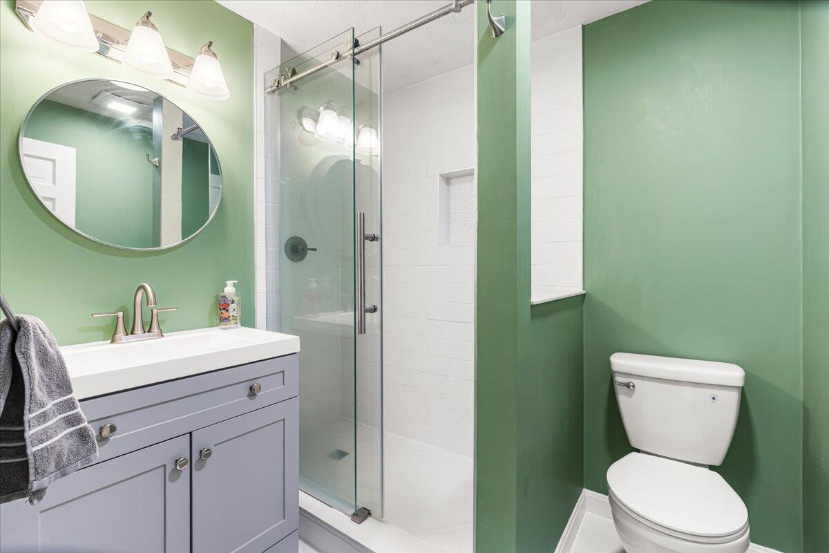 48 Valley Brook Road Centerville, MA 02632 - Photo 27 of 34 a bathroom with a toilet a sink and mirror