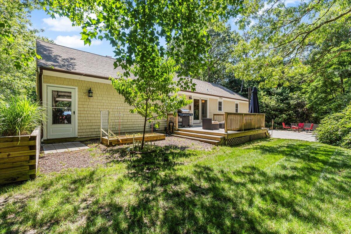 48 Valley Brook Road Centerville, MA 02632 - Photo 6 of 34 a house view with a backyard space