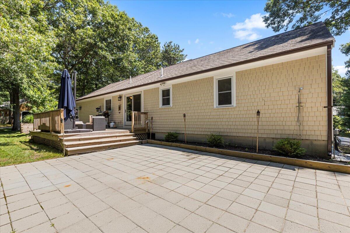 48 Valley Brook Road Centerville, MA 02632 - Photo 7 of 34 a view of a back yard of the house