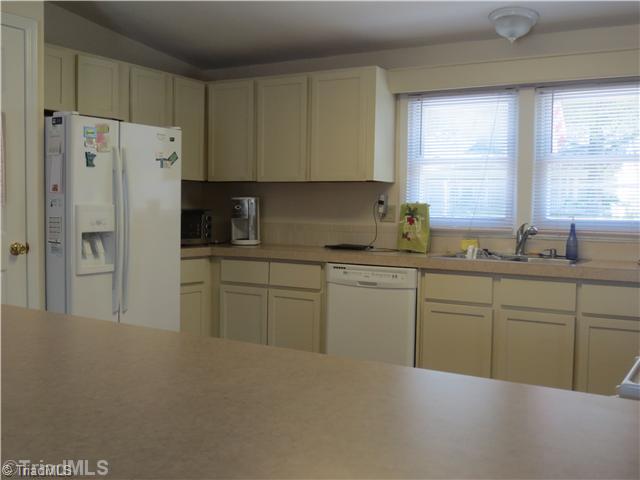 4600 Grubbs Road Walkertown, NC 27051 - Photo 11 of 16 Kitchen. VIEW OF KITCHEN FROM DEN. DEN HAS FRENCH DOORS THAT LEAD TO DECK WITH GREAT POTENTIAL FOR ENTERTAINING OR JUST ENJOYING SOME PEACE AND QUET!