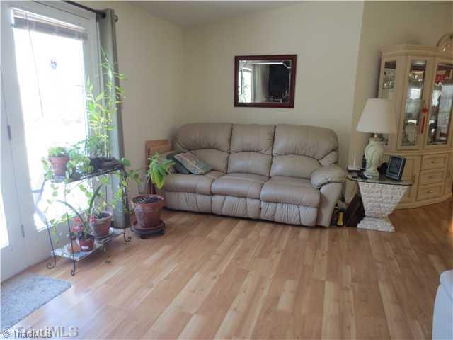 4600 Grubbs Road Walkertown, NC 27051 - Photo 12 of 16 Den/Family/Great Room. LOVELY DEN WITH FRENCH DOORS SO YOU CAN TAKE YOUR FOOD FROM KITCHEN TO YOUR DECK FOR GRILLING OR JUST ENJOY A COZY NIGHT IN BESIDE THE FIREPLACE