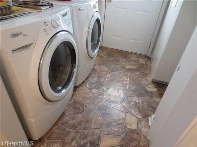 4600 Grubbs Road Walkertown, NC 27051 - Photo 10 of 16 Laundry Room. LARGE LAUNDRY AREA WITH HALF BATH AND EXIT TO THE FRONT OF HOME BESIDE THE DETACHED GARAGE