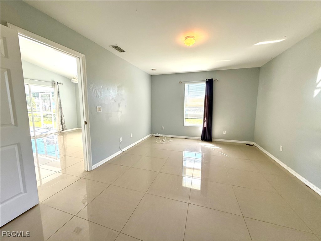 2911 40th Street Southwest Lehigh Acres, FL 33976 - Photo 11 of 22 a view of an empty room and window