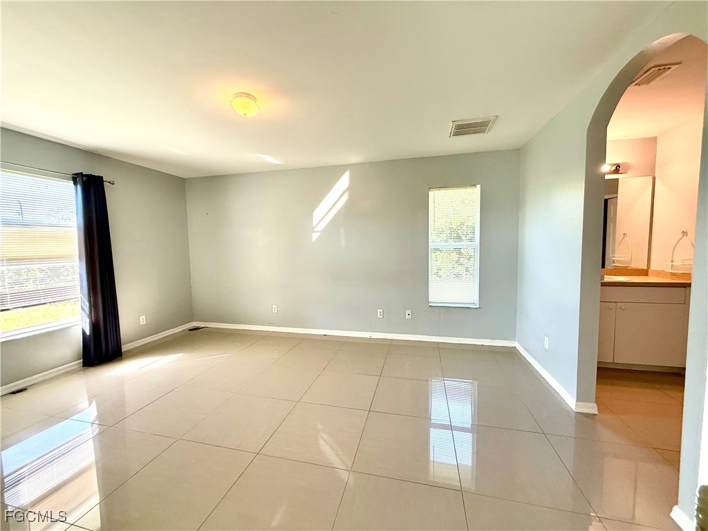 2911 40th Street Southwest Lehigh Acres, FL 33976 - Photo 12 of 22 a view of an empty room and window