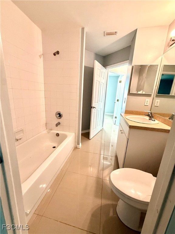 2911 40th Street Southwest Lehigh Acres, FL 33976 - Photo 17 of 22 a bathroom with a sink a toilet a tub and shower