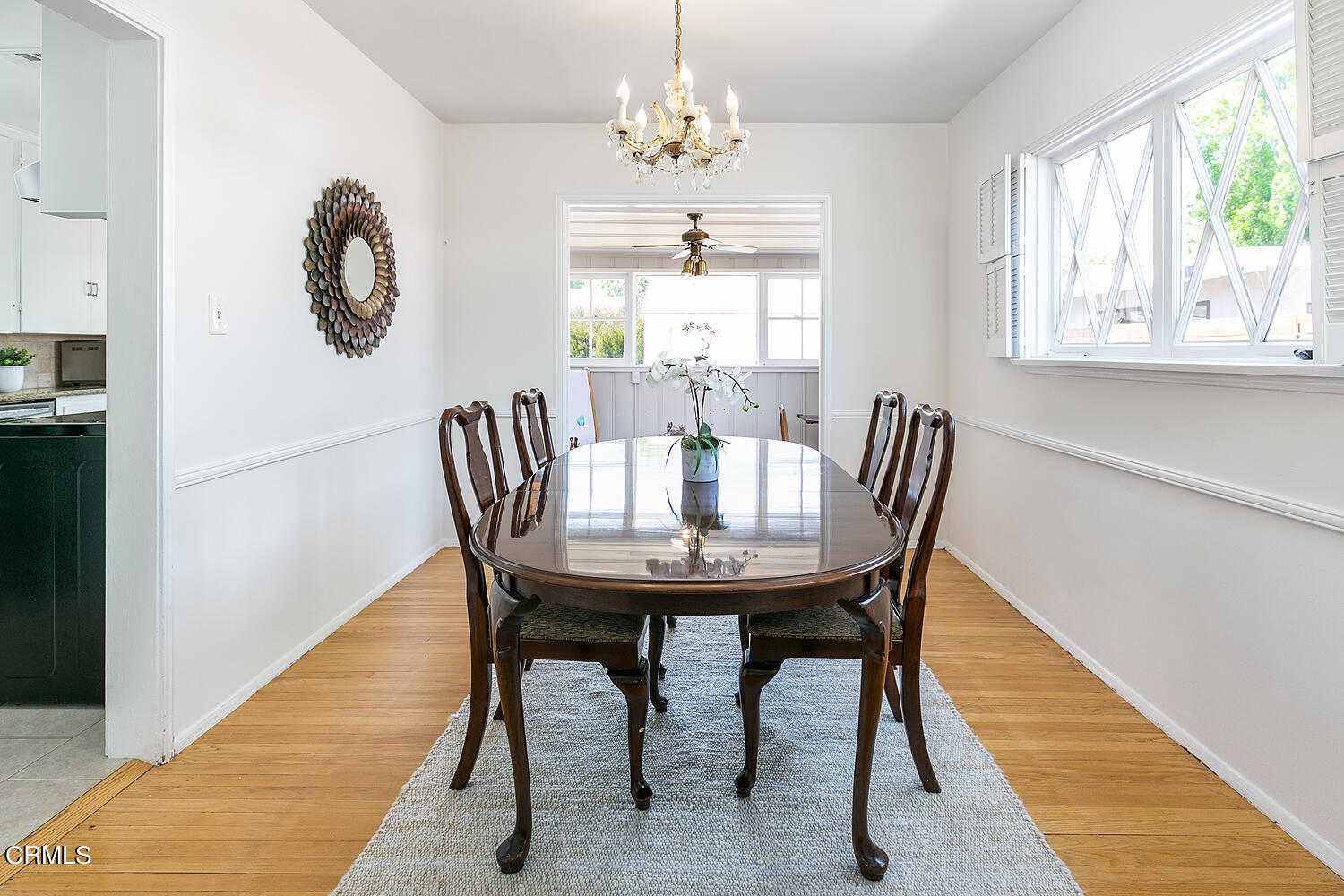 2375 East Woodlyn Road Pasadena, CA 91104 - Photo 11 of 33 a view of a dining room with furniture and a chandelier