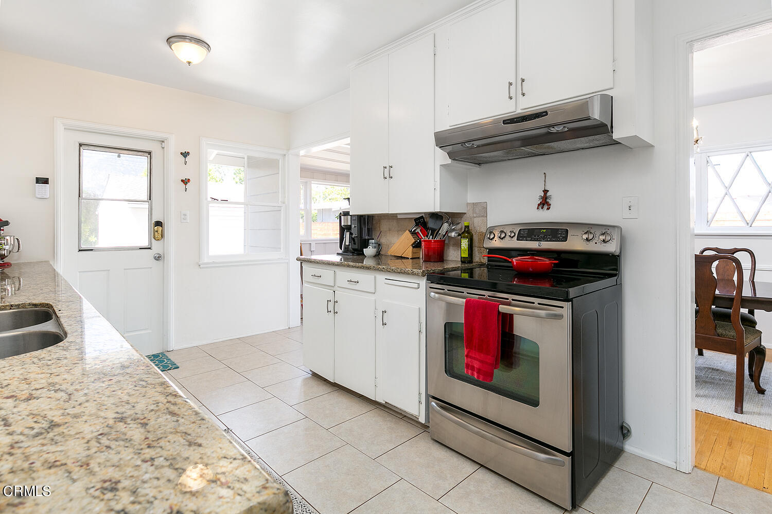 2375 East Woodlyn Road Pasadena, CA 91104 - Photo 13 of 33 a kitchen with stainless steel appliances granite countertop a stove and cabinets
