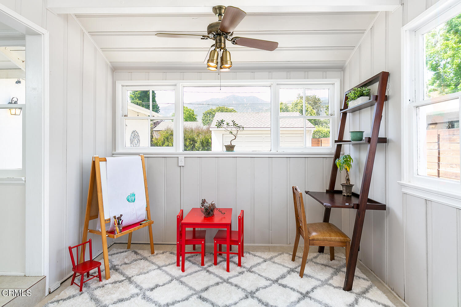 2375 East Woodlyn Road Pasadena, CA 91104 - Photo 16 of 33 a view of a dining room with furniture a chandelier and a window