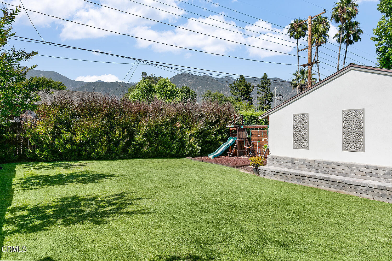 2375 East Woodlyn Road Pasadena, CA 91104 - Photo 31 of 33 a view of a backyard with plants and a bench