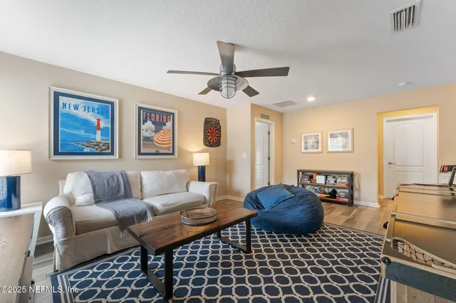 a living room with furniture and a rug