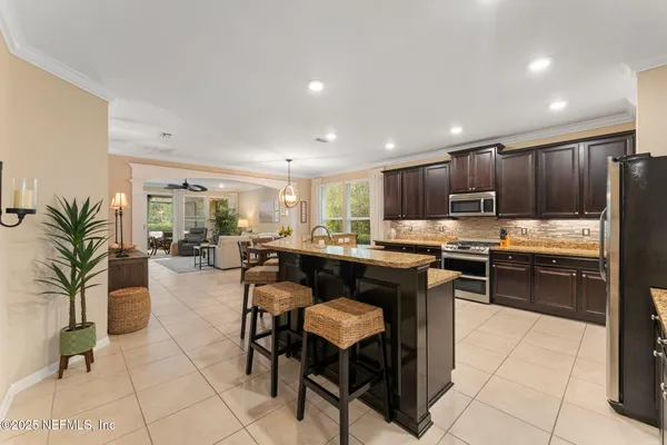 a kitchen with granite countertop lots of counter top space and cabinets