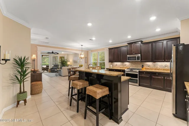 a kitchen with granite countertop lots of counter top space and cabinets