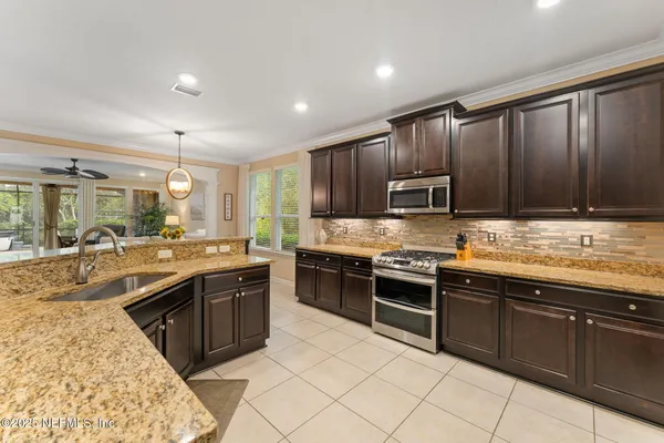 a large kitchen with wooden cabinets