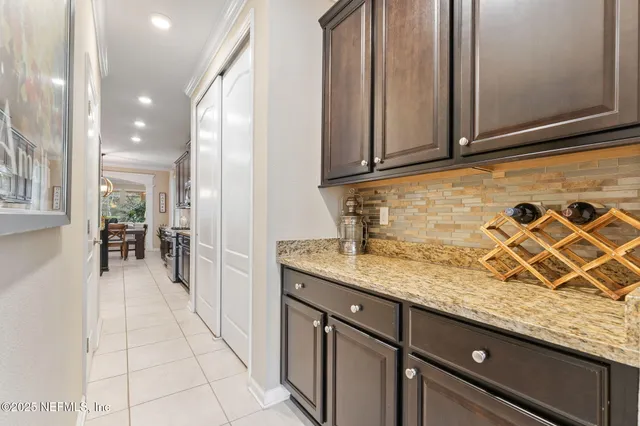 a kitchen with stainless steel appliances granite countertop a sink and cabinets