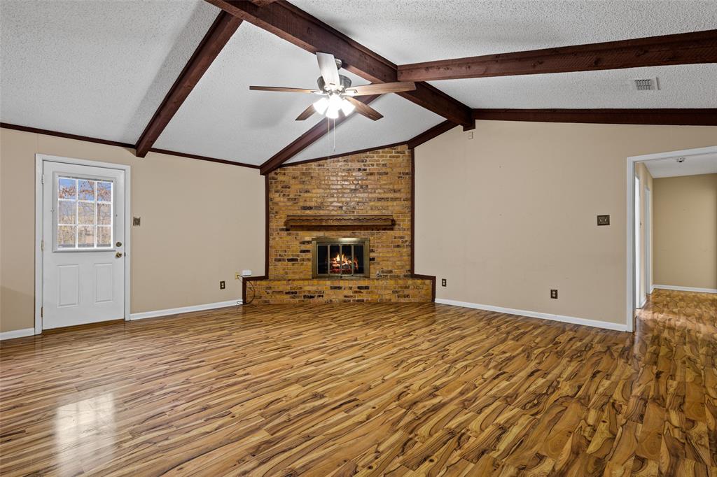 3215 Restview Street Longview, TX 75605 - Photo 12 of 40 a view of empty room with wooden floor and fan