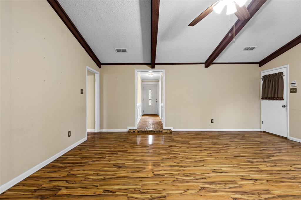 3215 Restview Street Longview, TX 75605 - Photo 13 of 40 a view of room with window and wooden floor