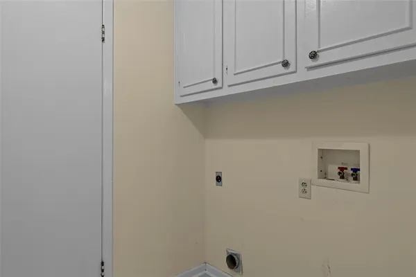 a view of a hallway with a door