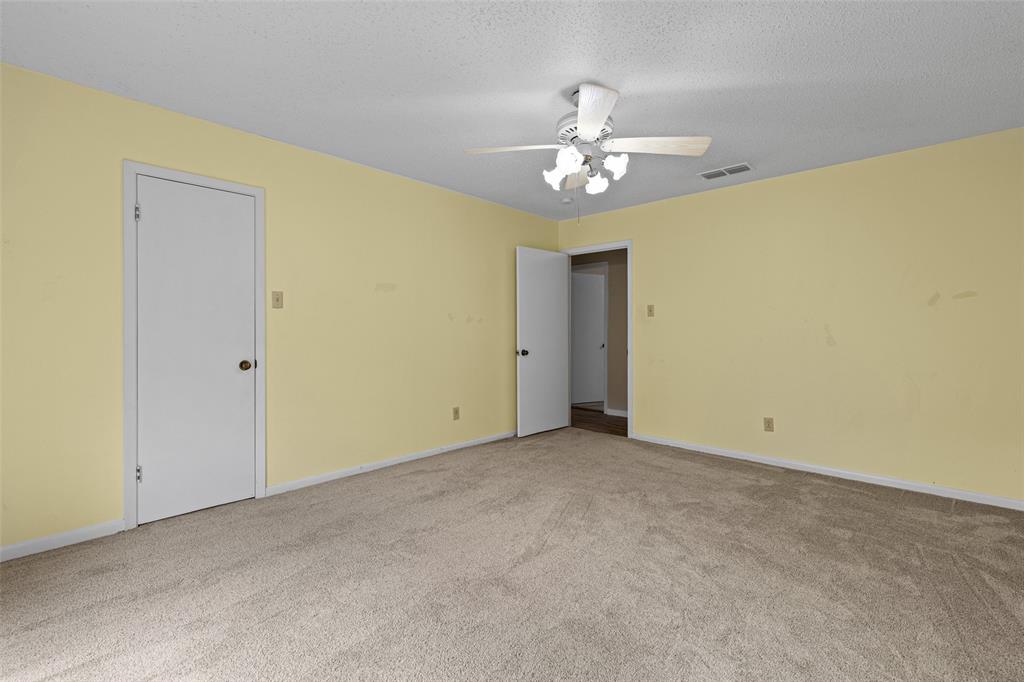 3215 Restview Street Longview, TX 75605 - Photo 25 of 40 a view of an empty room with a chandelier fan
