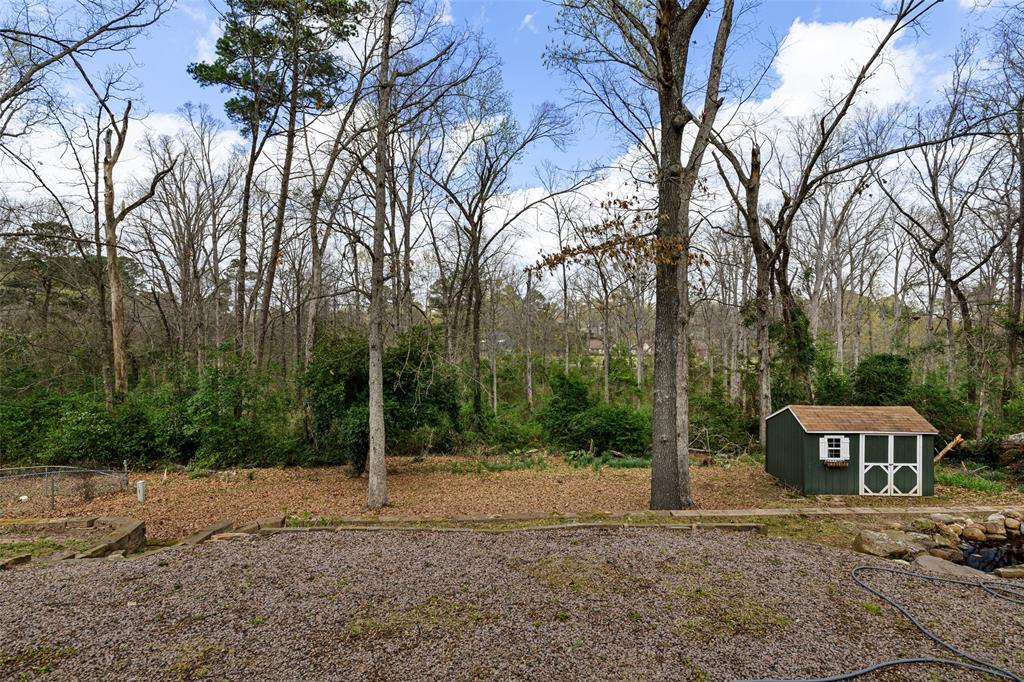 3215 Restview Street Longview, TX 75605 - Photo 33 of 40 a view of a house with a yard
