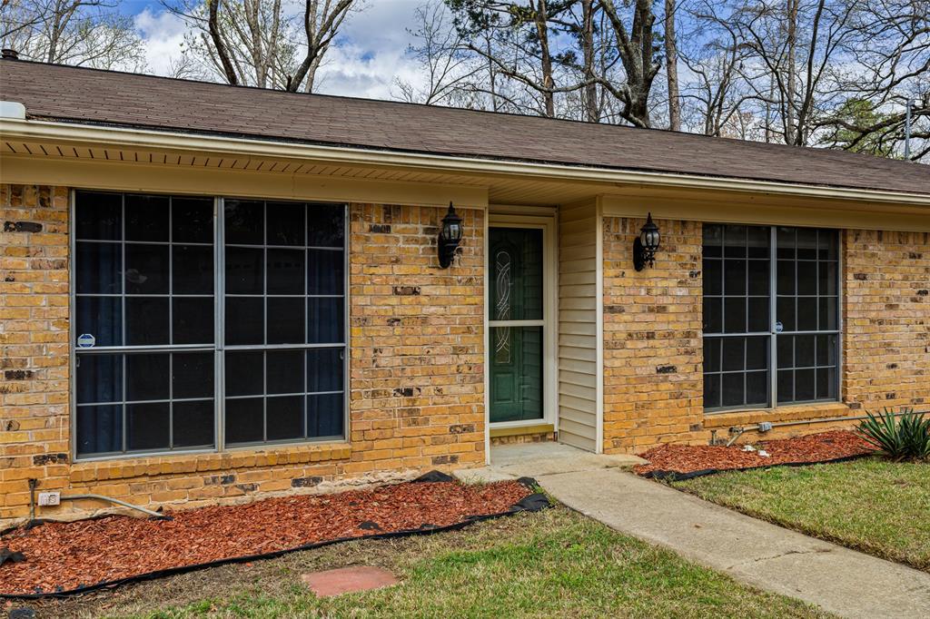 3215 Restview Street Longview, TX 75605 - Photo 5 of 40 a front view of a house with a yard