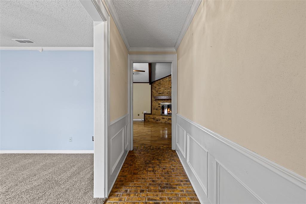 3215 Restview Street Longview, TX 75605 - Photo 6 of 40 a view of a hallway with wooden floor and staircase