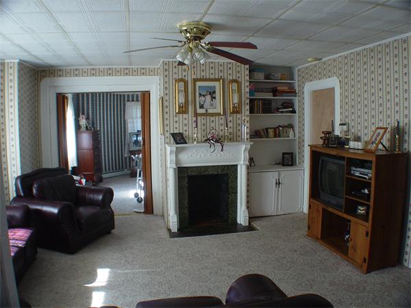 210 4th Street Fall River, MA 02721 - Photo 12 of 27 a living room with furniture and a fireplace