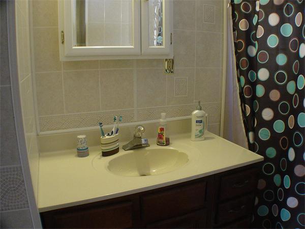 210 4th Street Fall River, MA 02721 - Photo 13 of 27 a bathroom with a sink a vanity and a shower