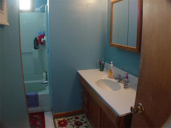 210 4th Street Fall River, MA 02721 - Photo 17 of 27 a bathroom with a sink and a mirror