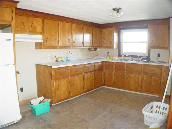 210 4th Street Fall River, MA 02721 - Photo 18 of 27 a kitchen with a sink cabinets and window