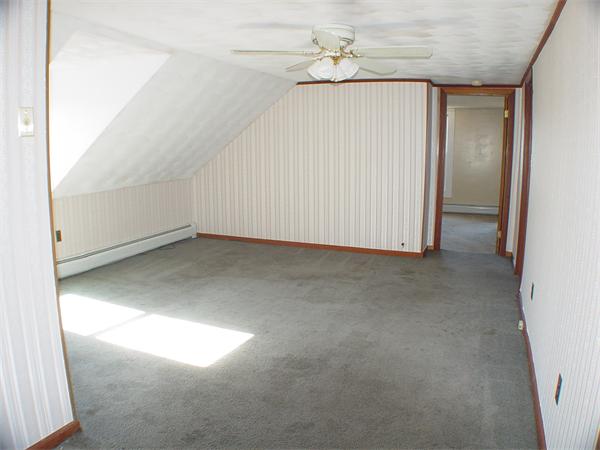 210 4th Street Fall River, MA 02721 - Photo 19 of 27 an empty room with a ceiling fan
