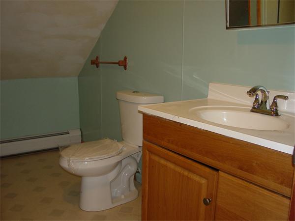 210 4th Street Fall River, MA 02721 - Photo 20 of 27 a bathroom with a sink and a toilet