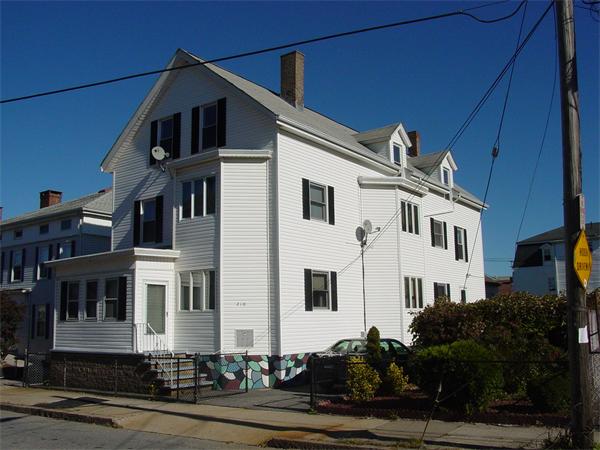 210 4th Street Fall River, MA 02721 - Photo 2 of 27 a front view of a house with a yard