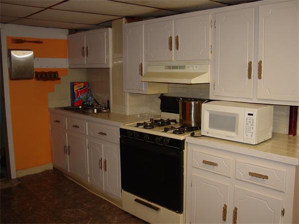 210 4th Street Fall River, MA 02721 - Photo 21 of 27 a kitchen with stainless steel appliances granite countertop a sink stove and cabinets