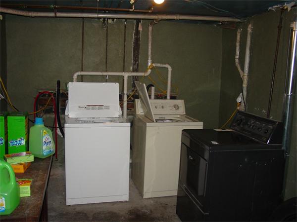 210 4th Street Fall River, MA 02721 - Photo 27 of 27 a storage room with washer and dryer