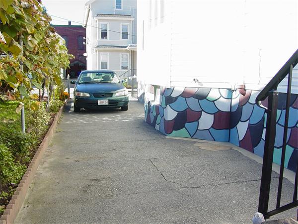 210 4th Street Fall River, MA 02721 - Photo 4 of 27 a view of a yard with cars parked in front of it