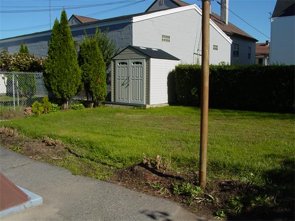 210 4th Street Fall River, MA 02721 - Photo 7 of 27 a front view of a house with garden