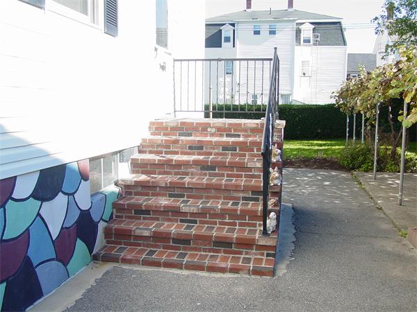 210 4th Street Fall River, MA 02721 - Photo 9 of 27 a view of a building with backyard