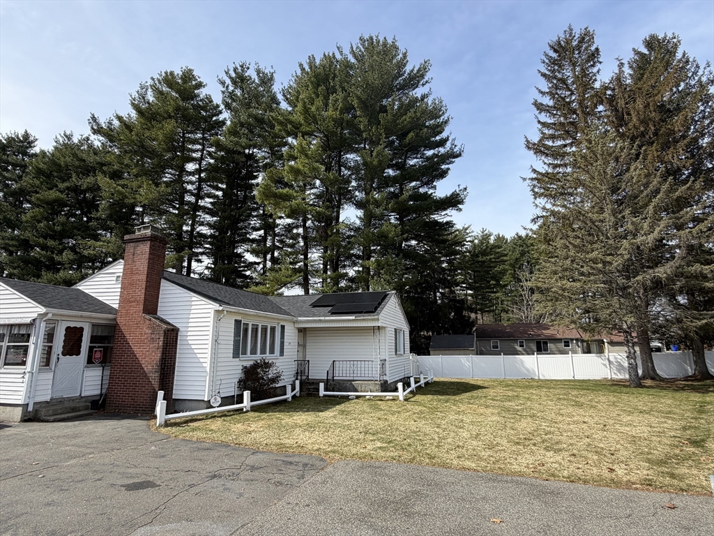 129 Fernbank Road Springfield, MA 01129 - Photo 4 of 24 a house that has a tree in front of it