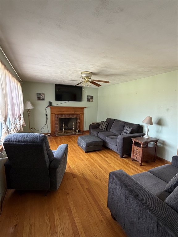 129 Fernbank Road Springfield, MA 01129 - Photo 10 of 24 a living room with furniture fireplace and a flat screen tv