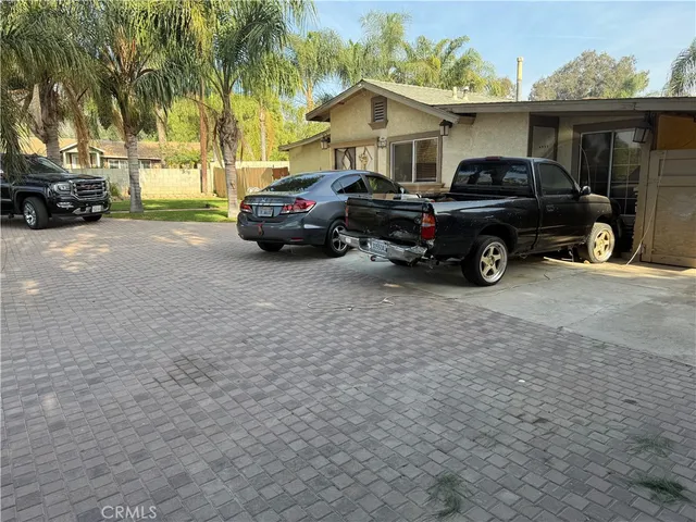 a view of a car parked in front of a house
