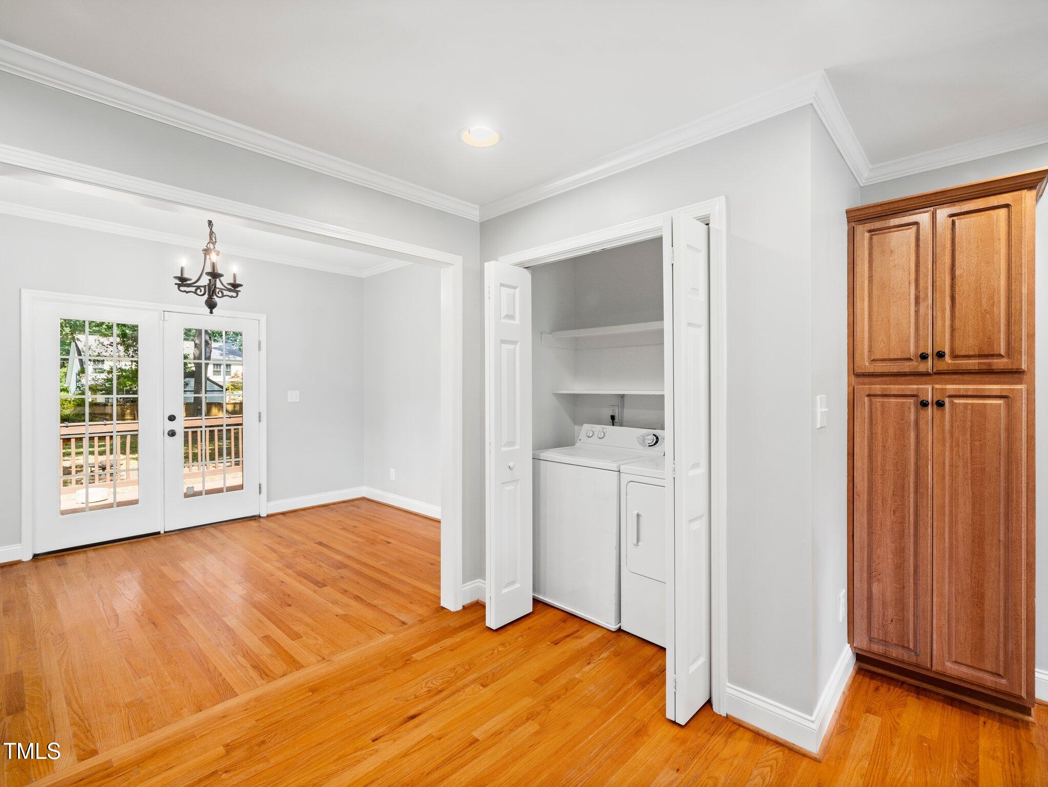 1825 Watkins Street Raleigh, NC 27604 - Photo 11 of 27 a view of an empty room with wooden floor and a window