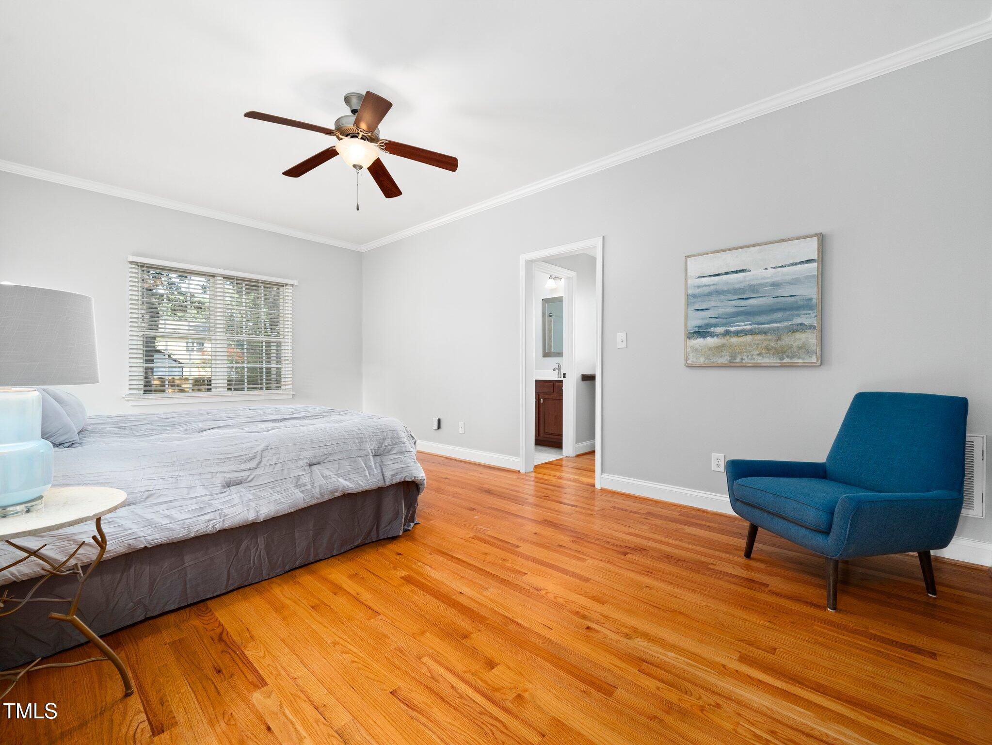 1825 Watkins Street Raleigh, NC 27604 - Photo 13 of 27 a bedroom with a bed and window