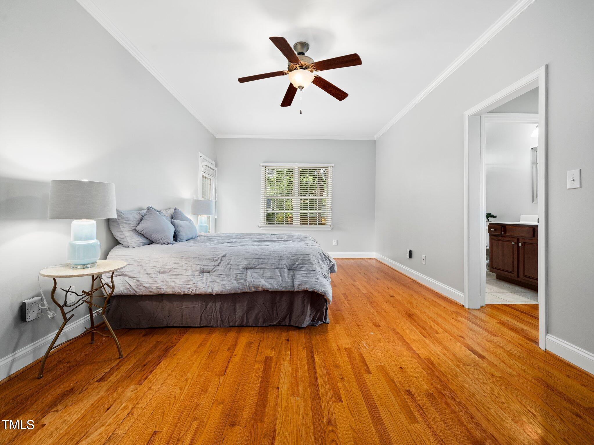 1825 Watkins Street Raleigh, NC 27604 - Photo 14 of 27 a bedroom with a bed and window
