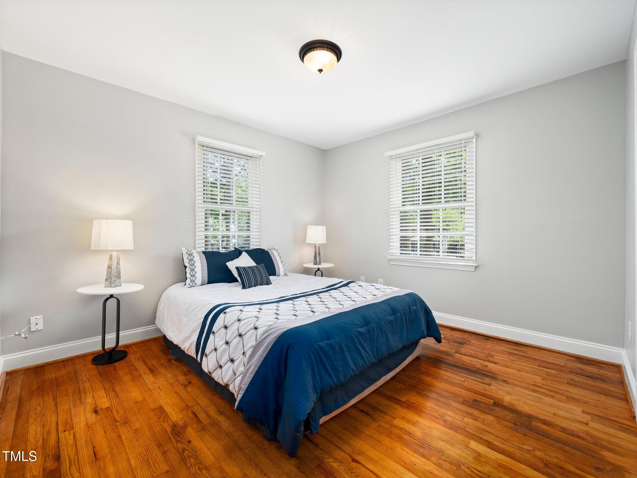1825 Watkins Street Raleigh, NC 27604 - Photo 18 of 27 a bedroom with bed and window