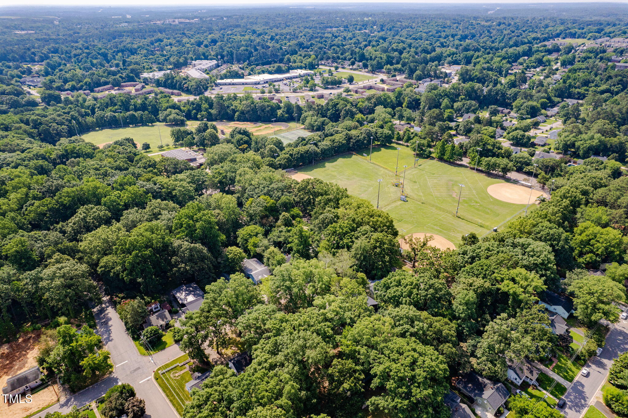 1825 Watkins Street Raleigh, NC 27604 - Photo 25 of 27 an aerial view of residential houses with outdoor space and trees