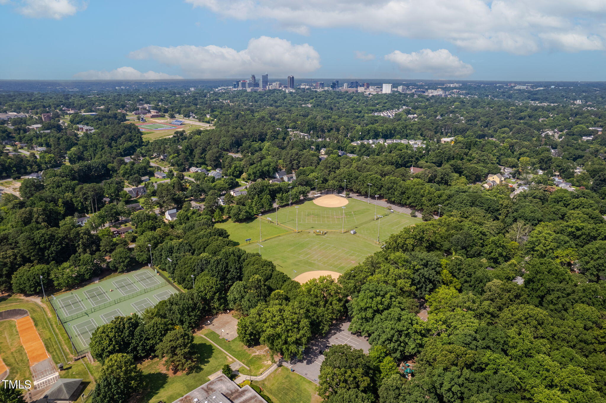 1825 Watkins Street Raleigh, NC 27604 - Photo 27 of 27 an aerial view of a house with a yard and lake view