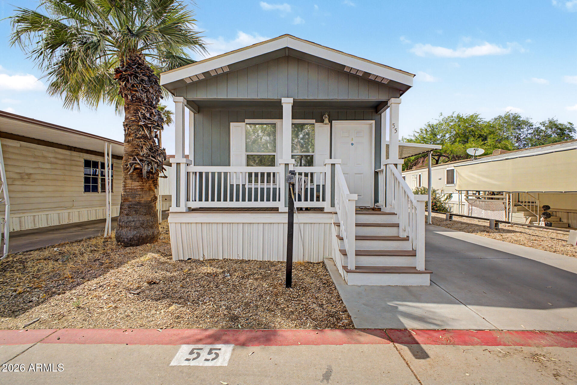 625 West McKellips Road, Unit 55 Mesa, AZ 85201 - Photo 1 of 21 a porch with seating space