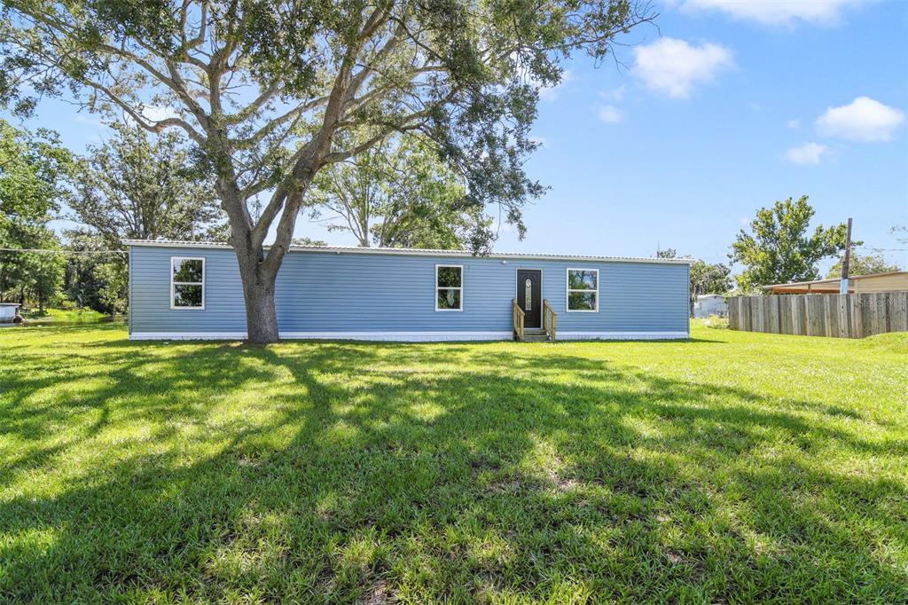 3380 Maple Lane Haines City, FL 33844 - Photo 1 of 28 a front view of a house with yard