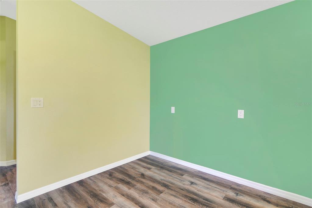 3380 Maple Lane Haines City, FL 33844 - Photo 12 of 28 a view of empty room with wooden floor